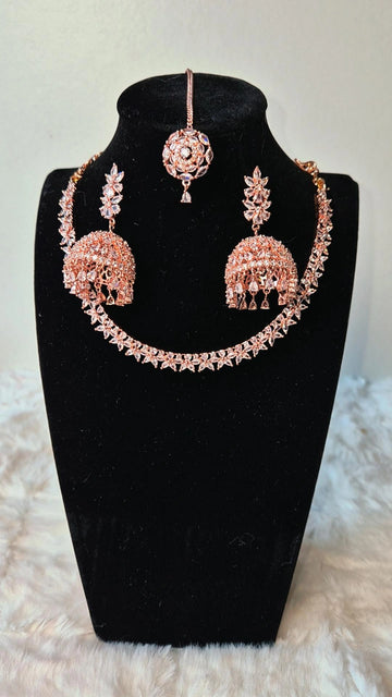 Rose Gold Radiance: Necklace, Jhumka & Tikka Set with AD Stones