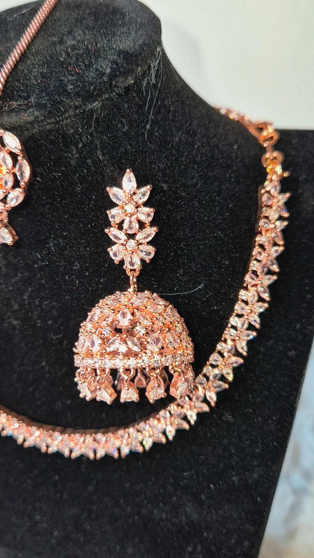 Rose Gold Radiance: Necklace, Jhumka & Tikka Set with AD Stones